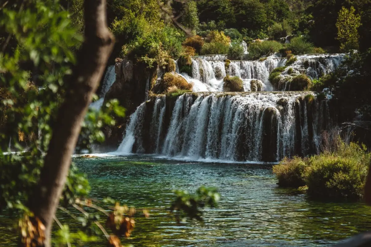 A close-up view of the cascading Krka Waterfalls, capturing the mesmerizing beauty of the rushing water.